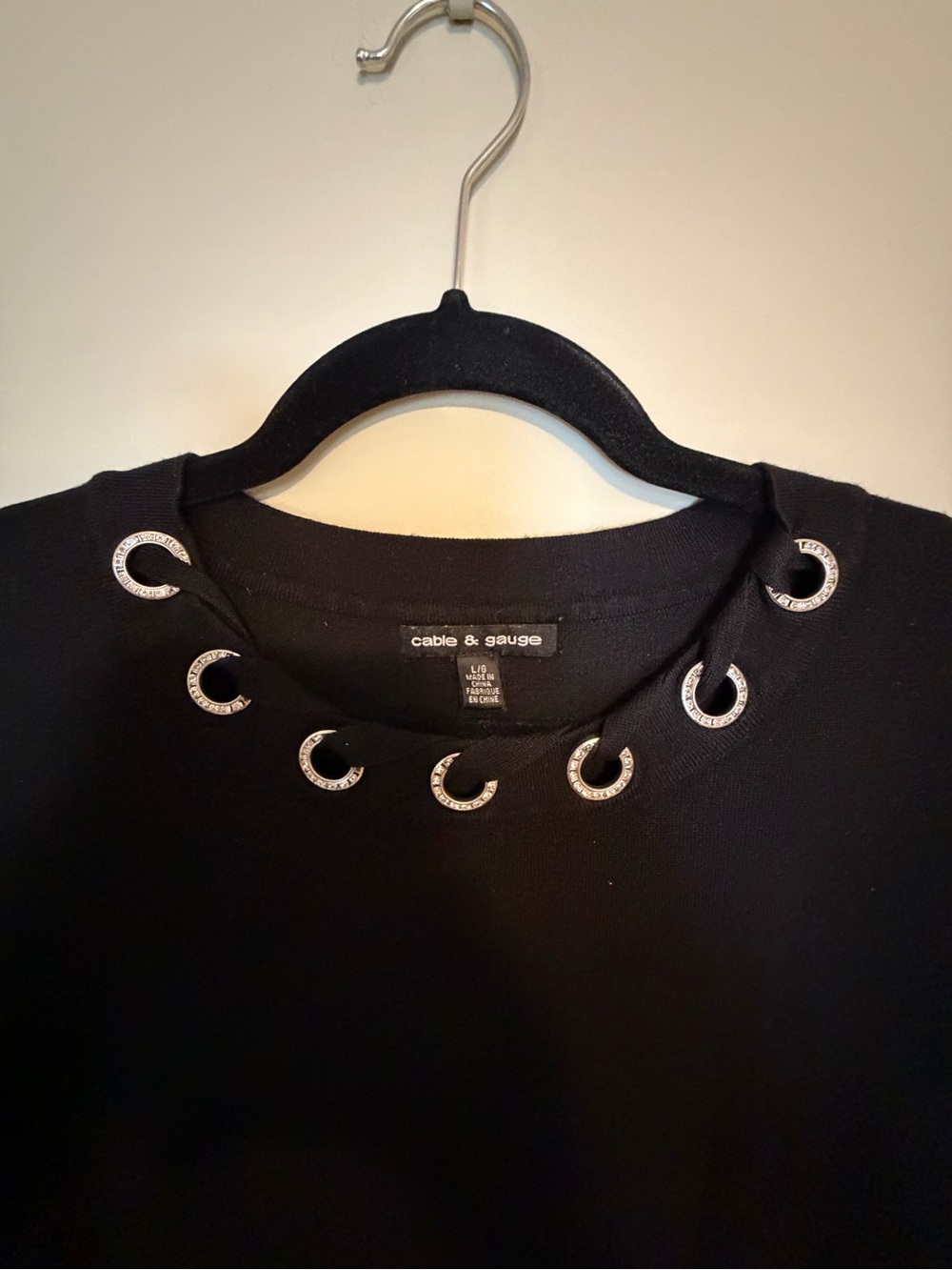 Cable & Gauge Black Knit Top with Silver Grommet Trim